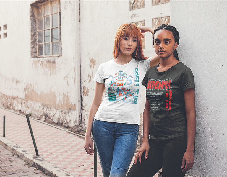 T-Shirt-Mockup-of-two-Women-Standing-by-a-Decayed-Wall